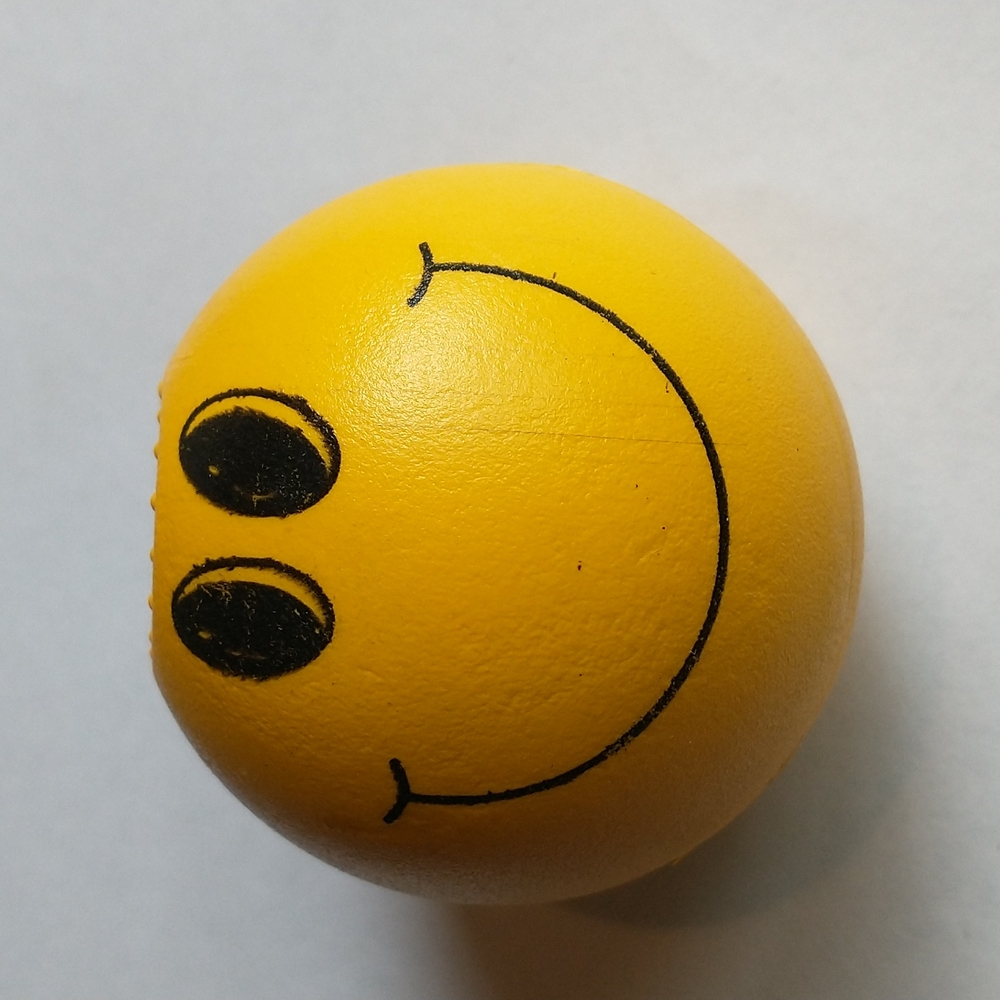 Happy face twist ball grinder